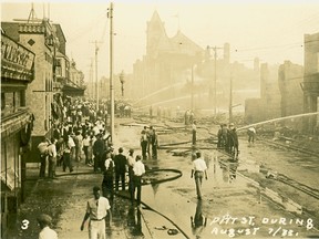 A Cornwall Community Museum file photo showing firefighters knocking down the final embers of the 1933 fire that devastated downtown Cornwall.