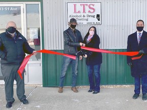 LTS Alcohol and Drug Testing owners Tammy and Landon Nahorney (centre) were joined by Wetaskiwin Mayor Tyler Gandam right and Chamber secretary Wayne DiLallo (left) in a ribbon cutting ceremony to welcome the new business to Wetaskiwin last week.