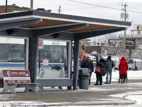 Riders line up to catch a city bus at the city's transit terminal on Oak Street, November 2018. Nugget File Photo