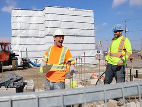 Workmen share a laugh at the construction site for the Ska:na Family Learning Centre in Wallaceburg. When opened, the new daycare will have 49 childcare spots. Carl Hnatyshyn/Postmedia Network