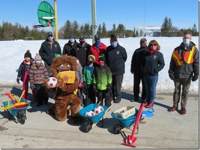 K.T.T. P.S. students display a few of their purchases to Larry the Lion and Lions Larry Bannerman, Phil Thompkins, Paul Thompson, Peter Morris, John Paterson, Dennis Flavell, Helen Gitter Flavell and principal Graham Martin. SUBMITTED