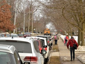 Streets like this one near Avon Public School are often congested with vehicles as parents and guardians drop off or pick up students in the mornings and afternoons. Local police and parking enforcement are now working to ensure drivers know when and where they can stop or park to improve safety for students in school zones across the city. (Galen Simmons/The Beacon Herald)