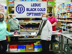 The Leduc Blackgold Optimists Club donated $200 to the Leduc & District Food Bank on Mar. 6 to kick off the Social Distancing Check Challenge. (Lisa Berg)