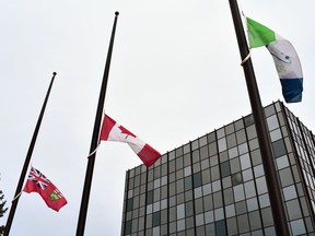 The flags at North Bay City Hall are seen at half-mast, Thursday, to mark the one-year anniversary since the World Health Organization declared COVID-19 a pandemic. 
City of North Bay Photo
