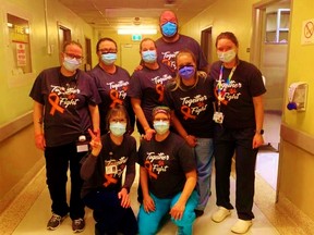 Staff at Norfolk General Hospital are wearing T-shirts these days in support of a beloved colleague who was diagnosed with leukemia in the week before Christmas.  From left, Emily Lynch, Cheryl Golding, Jeanne O’Donnell, Becky Lennon, Anna Wilson, Johnny White, Melissa Frank and Taylor Bluhm. – NGH photo