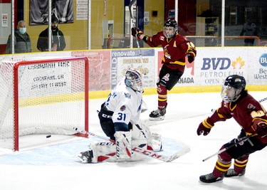 Josh Dickson, background, and Zach Smith celebrate Smith’s first-period shorthanded goal during Saturday night’s NOJHL game at the Tim Horton Event Centre in Cochrane while the puck bounces out of the net behind Crunch goalie Liam McCarthy. Smith would add a second shorthanded marker and set up a pair of goals to help lead the Rock to a 9-4 win over the Crunch in the second game of their 10-game set. THOMAS PERRY/THE DAILY PRESS