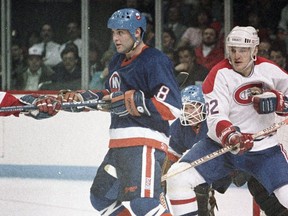 New York Islanders defenceman Randy Boyd (8) battles Montreal Canadiens forward Claude Lemieux (32) in a game at the Montreal Forum during the 1986-87 season.
