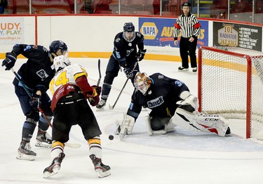 Timmins Rock forward Nicolas Pigeon pounces on a juicy rebound in front of Crunch goalie Liam McCarthy as Cochrane defenders Liam Boswell, left, and Travis Szafron look on during the second period of Tuesday night’s NOJHL game at the McIntyre Arena. Pigeon scored on the play to give the Rock a 3-1 lead in a game they would go on to win 9-1. The two sides will meet again at the Tim Horton Event Centre in Cochrane on Friday, at 8 p.m. THOMAS PERRY/THE DAILY PRESS