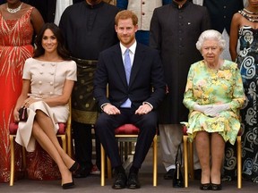 Queen Elizabeth, Prince Harry and Meghan, the Duchess of Sussex, pose for a picture in London, June 26, 2018. PHOTO BY REUTERS