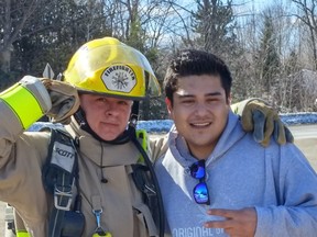 Saugeen Reserve Fire Department firefighter Dylan Roote (left) celebrated completing the first half of his 4 X 4X 48 challenge with buddy/encourager James Besito outside the Saugeen First Nation fire hall March 6. At last check, Roote had helped generate approximately $2,900 for Wounded Warriors Canada.