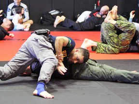 In a time before COVID-19, officers train scenarios on each other during the Gracie Survival Tactics course hosted at the Hayabusa Academy in Kingston on June 7, 2019.