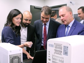 Tara McGoey, left, outlines some of the results of a DNA sequencing operation to Kashif Khan, CEO of The DNA Company, Nipissing-Timiskaming MP Anthony Rota and Canadore College president George Burton, in September, 2019, at the official opening of the Functional Genomics Lab at Canadore. The lab will be part of a provincewide effort to sequence and characterize coronavirus strains.
Nugget File Photo