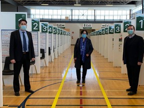 (L-R) Dr. Ian Arra, Mayor Anne Eadie and Drew Ferguson stand in the Davidson Centre gymnasium, which is now being used as a mass vaccination centre, on Thursday, March 11. Hannah MacLeod/Kincardine News