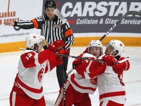 Soo Greyhounds forward Tye Kartye (left) celebrates a goal with teammates Zack Trott and Robert Calisti during 2020 OHL action in Peterborough. Clifford Skarstedt/Peterborough Examiner