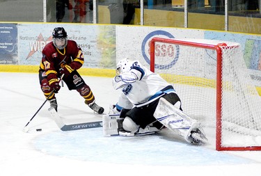 Timmins Rock forward Harry Clark puts on the brakes to cut in front of Cochrane Crunch goalie Michael Nickolau during the second period of Friday night’s NOJHL contest at the Tim Horton Event Centre. While Clark was able to get off a shot, Nickolau was able to get a pad in front of it to deflect the puck past the post. Clark did score a third-period goal, however, as the Rock went on to roll over the Crunch 9-1. THOMAS PERRY/THE DAILY PRESS