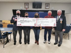 The Royal Canadian Legion branches 291 (Okotoks) and 71 (High River) presented two cheques of $14,912.50 each for a total of $29,825.00 to the High River District Health Care Foundation on Mar. 12 at the High River Legion. The money came out of the Legion’s poppy fund, and will be used towards the System 2000 Assisted Bathing Solutions at the High River Hospital. Okotoks Legion President John MacCormack (from left to right), Poppy Funds Coordinator Okotoks – Nancy Toan, High River District Health Care Foundations’ Cathy Coey, Poppy Funds Coordinator High River- Fred Stegmeier, and High River Legion President Bob Collins were present for the donation.