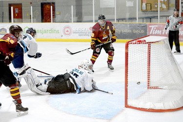 Timmins Rock forward Josh Dickson, right, watches as his one-timer bounces off the twine behind Crunch goalie Michael Nickolau during the second period of Sunday afternoon’s NOJHL game at the Tim Horton Event Centre in Cochrane. Dickson’s first of two goals on the night and 10th of the season proved to be the game-winner as the Rock went on to beat the Crunch 6-1. The two sides will play the seventh game of their 10-game set at the Tim Horton Event Centre on Wednesday, at 6:30 p.m. THOMAS PERRY/THE DAILY PRESS