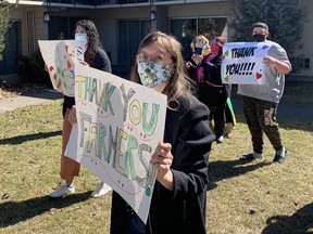 More than 20 people gathered at the Best Western Brant Park Inn on Saturday to thank seasonal farm workers from Jamaica, who are in quarantine at the Brantford hotel for 14 days before heading off to work at Norfolk area farms. The workers showed their appreciation for the gesture by stepping out to their balconies to acknowledge the cheers.