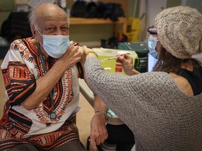 Abdul Makalai, 86, receives the COVID-19 vaccine from Corrina Bennett, RN at Silvera Aspen in Calgary. PHOTO BY ALBERTA HEALTH SERVICES