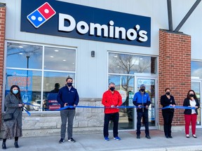 A ceremonial ribbon-cutting officially welcomed Domino’s Pizza to Port Elgin. Taralyn Golbeck (left), Director of Business Development and  Communications with the Saugeen Shores Chamber of Commerce, Mayor Luke Charbonneau, Domino’s Eastern Canadian rep Frank Fegan, Domino's Port Elgin franchisee Rick Singh, Chamber vice-president Michelle Kay-Scott, and Chamber member Lisa Seeley celebrated the opening March 12. SUPPLIED