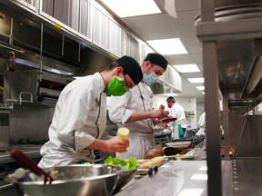 First-year culinary students Ashton Thurston, left, and Logan MacRae prepare sandwiches, Tuesday, at Canadore College as part of a lunch service for North Bay firefighters. Michael Lee/The Nugget