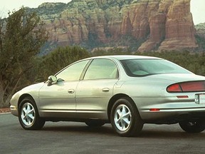 The 1995 Oldsmobile Aurora was the spiritual descendant of the original Toronado, as referenced by its signature taillight treatment. Handout