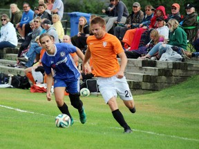 Dustin Boucha of the Centuries dashes down the sidelines with Dynamo's Riel Major in hot pursuit in the 2019 Kenora Men's League final at the Tom Nabb Soccer Complex. The local soccer association is seeking financial help to offset costs of running the facility incurred from the missed 2020 season.