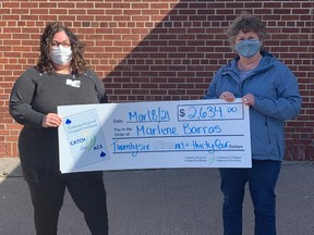 Marlene Barras, right, was the week four winner of the Pembroke Regional Hospital Foundation's Catch the Ace online progressive jackpot raffle. Presenting the winnings in the photo is Leigh Costello, community fundraising specialist for the foundation.