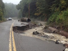 A section of roadway is washed out by the Goulais River after storms in Sault Ste. Marie Ont. early Tuesday morning on Sept 10 , 2013. The Sault Star