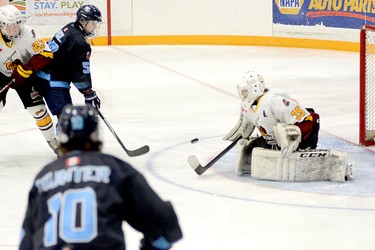 Timmins Rock goalie Tyler Masternak makes a save on a shot off the stick of Cochrane Crunch forward Benjamin Orgil during the first period of Tuesday night’s NOJHL game at the McIntyre Arena. Masternak, who was playing his final game in a Rock uniform, went on to post his NOJHL career-best 18th shutout as the Rock blanked the Crunch 3-0 in the final contest in their 10-game series. THOMAS PERRY/THE DAILY PRESS