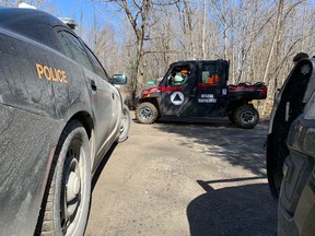 Ontario Provincial Police and search and rescue crews on Canoe Lake Road, south of Fermoy in South Frontenac.