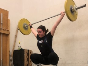 Ruth Chouinor completes a snatch lift at the North Bay YMCA. The 16-year-old Grade 10 student from Chippewa Secondary School lifted her way to the bronze medal at the Canadian Junior National Championships.