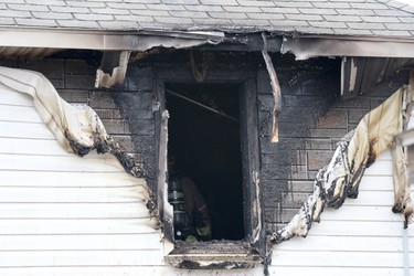 Firefightersrespond to a blaze at 218 Gloucester St., in Sault Ste. Marie, Ont., on Tuesday, March 30, 2021.  (BRIAN KELLY/THE SAULT STAR/POSTMEDIA NETWORK)