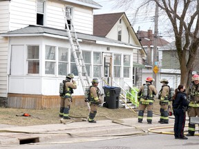 Firefighters and police respond to a blaze at 218 Gloucester St., in Sault Ste. Marie, Ont., on Tuesday, March 30, 2021.  (BRIAN KELLY/THE SAULT STAR/POSTMEDIA NETWORK)