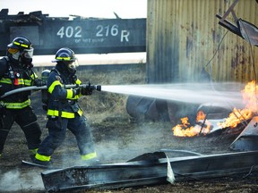 Local firefighters Wayne Tompkins, from Champion's department, and Kira Kinahan, from Caramangy's department, took part in the filming of a scene of the CBC series Heartland. The scene was shot at the Moseleigh train tracks in October, and five local firefighters were involved in the filming of the episode, which was part of Heartland's 14th season.The season finale of the 14th season aired March 21. Both Kinahan and Tompkins are huge fans of the show, so this was an excellent experience for them, said Doug Headrick, Vulcan County's director of protective services. DAVID T. BROWN/HEARTLAND