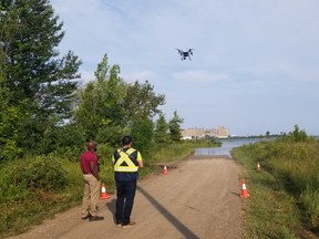 OPG drone pilots fly a drone at Baie du Dore, at the Bruce site. The drone is used to identify the extent of phragmites, an invasive species. OPG Photo