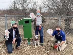 EcoDog Boxes, nine public dispensers where local dog owners can find a last-minute dog waste bag, have been restocked in St. Marys. Pictured is Rick Culbert, chief executive of Veterinary Purchasing, left, retired vet Robert Linton with miniature schnauzer Eli, and Mayor Al Strathdee with his cockapoo Patsy. (Contributed photo)
