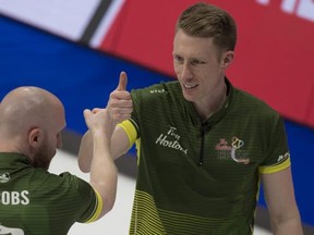 Photo courtesy Curling Canada

Marc Kennedy (right) celebrates a shot with his Northern Ontario teammates E.J. Harnden (left) and Brad Jacobs at the 2020 Tim Hortons Brier in Kingston, Ont.