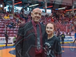 Photo Provided

Morgan Leonard (right) celebrates with her coach, Sergio Campioni, after winning a gold medal at the 2020 OFSAA Wrestling Championships at GFL Memorial Gardens