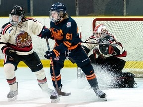 Photo courtesy NOJHL

Soo Thunderbirds centre Cooper Smyl (middle) battles for position with Blind River defenceman Teegan Dumont in front of goalie Gavin Disano in recent NOJHL action