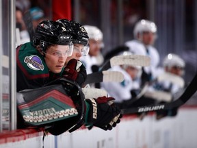 Jakob Chychrun (6) of the Arizona Coyotes watches from the bench during the third period of the NHL game against the San Jose Sharks at Gila River Arena on January 16, 2021 in Glendale, Arizona.  The Coyotes defeated the Sharks 5-3.  (Photo by Christian Petersen/Getty Images)