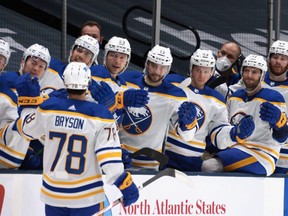 London native Jacob Bryson celebrates his first-ever NHL goal with Buffalo Sabres teammates during the team's game Saturday against the New York Islanders. (Bruce Benett/Getty Images)
