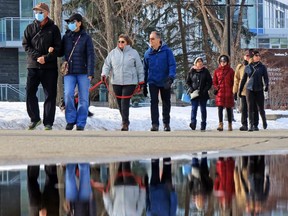 Calgarians enjoy a sunny warm afternoon for some exercise along the Bow River pathway on Sunday, February 28, 2021. Alberta Health is encouraging people to plan their upcoming spring breaks around public health measures as survey results show more Albertans intend to travel domestically than those in other provinces.