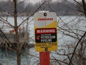 A sign marks where an Enbridge pipeline lands near Sarnia after crossing the St. Clair River'