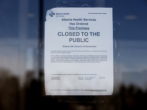 An Alberta Health Services closure order is visible posted on the front door of GraceLife Church, in Spruce Grove Friday March 5, 2021. PHOTO BY DAVID BLOOM /Postmedia