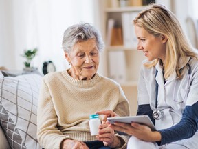 A personal support worker speaks with a client. SUPPLIED