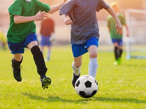 Youths playing soccer