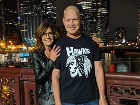 Photo Provided

Former Greyhound Hugh Larkin (right) and his wife, Carolyn, stand on a bridge overlooking the Chicago River in 2019