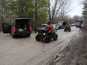 Ontario Provincial Police on foot and all-terrain vehicles search for Jude Leyton, 3, near Canoe Lake Road in South Frontenac on Wednesday.