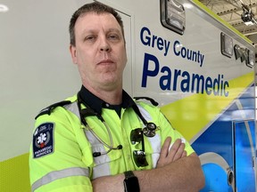 Grey County community paramedic Rick Trombley stands in front of a Grey County Paramedic Services vehicle at the Owen Sound station. SUPPLIED